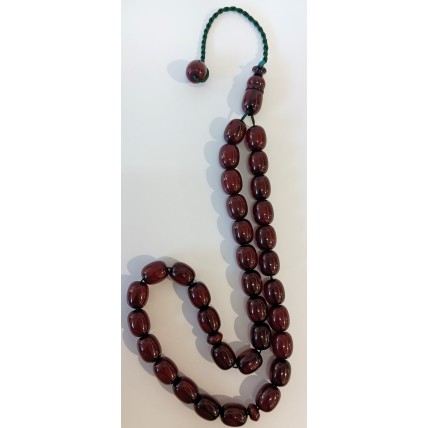 Κομπολόι με πράσινο κομποσκοίνι και οβάλ χάντρες από κεχριμπάρι φατουράν χρώματος κερασιού (KOM17)